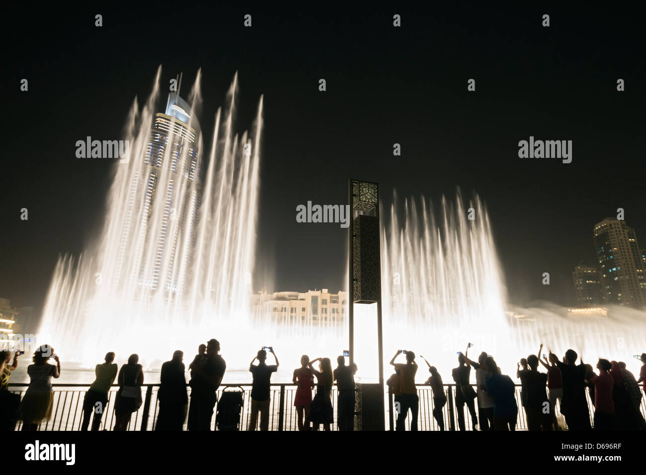 View at night of Dubai Fountain at the Dubai Mall in Downtown Dubai United Arab Emirates Stock