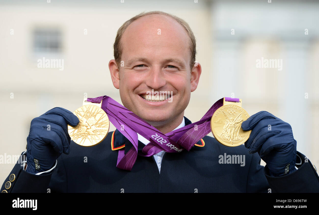 Germany's Michael Jung, celebrates after winning the gold medals of