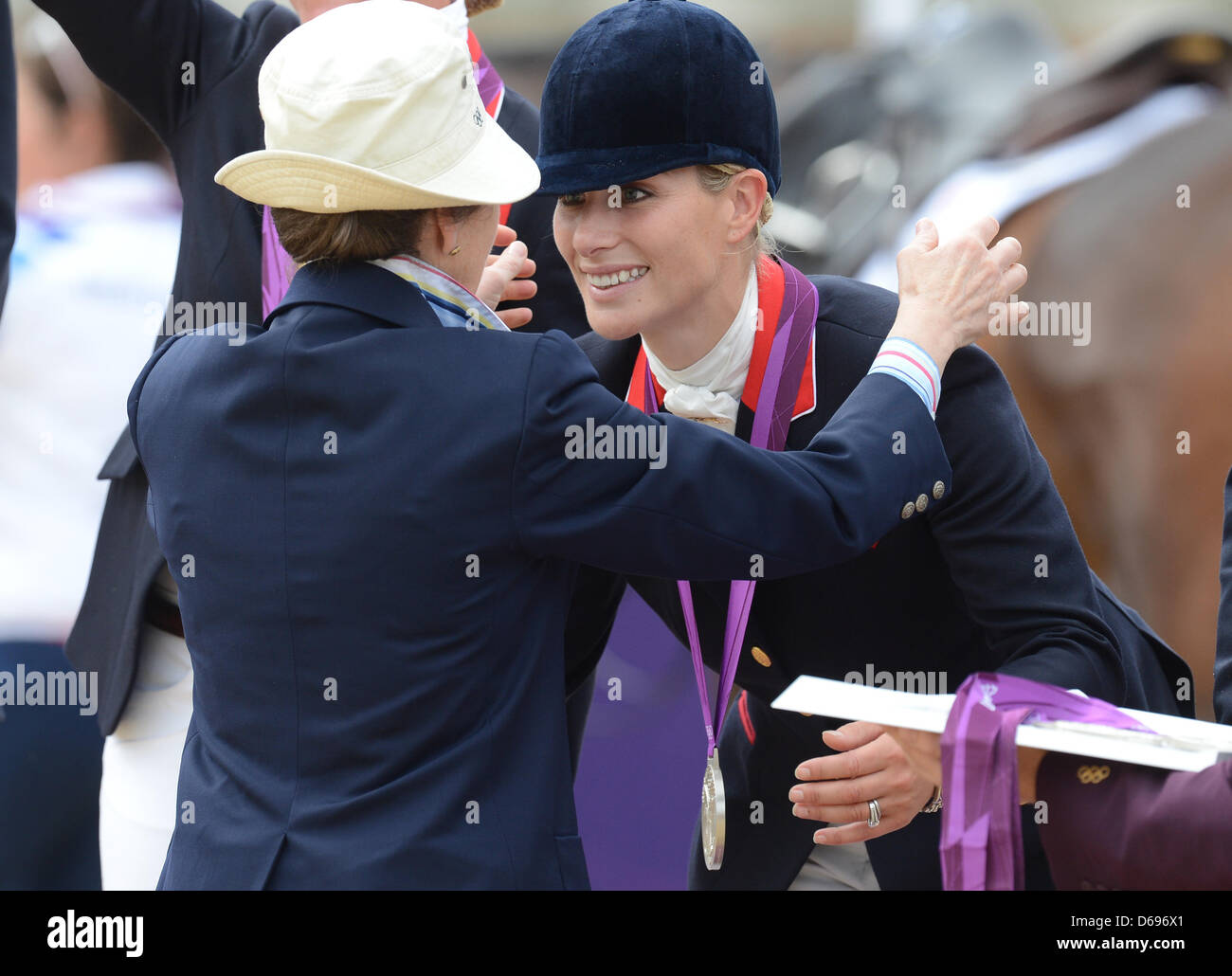 Zara Phillips of Great Britain receives her silver medal form British  Princess Anne (L), Princess Royal after the Equestrian team Eventing during  the London 2012 Olympic Games in Greenwich Park, London, Britain,
