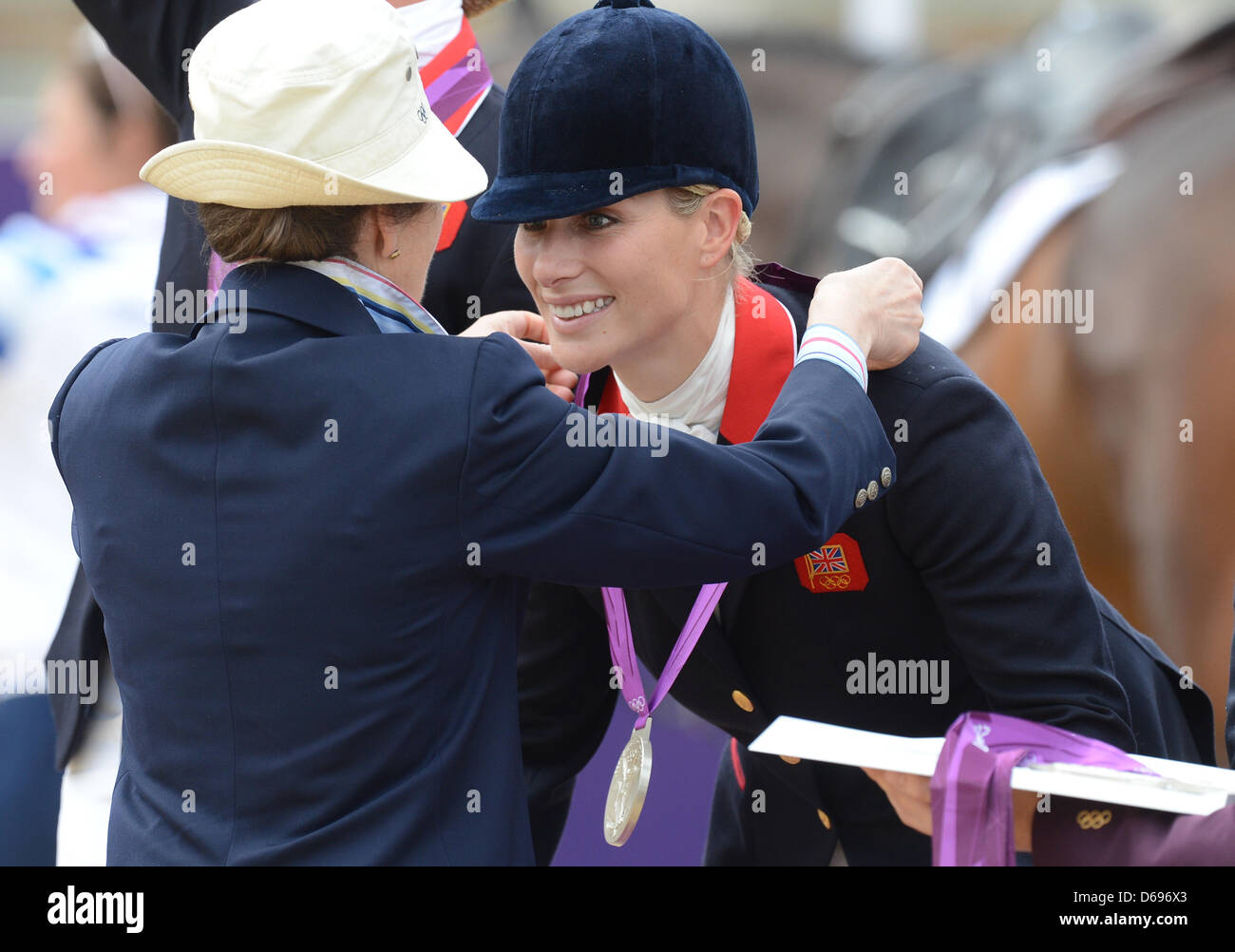 Zara Phillips of Great Britain receives her silver medal form British  Princess Anne (L), Princess Royal after the Equestrian team Eventing during  the London 2012 Olympic Games in Greenwich Park, London, Britain,