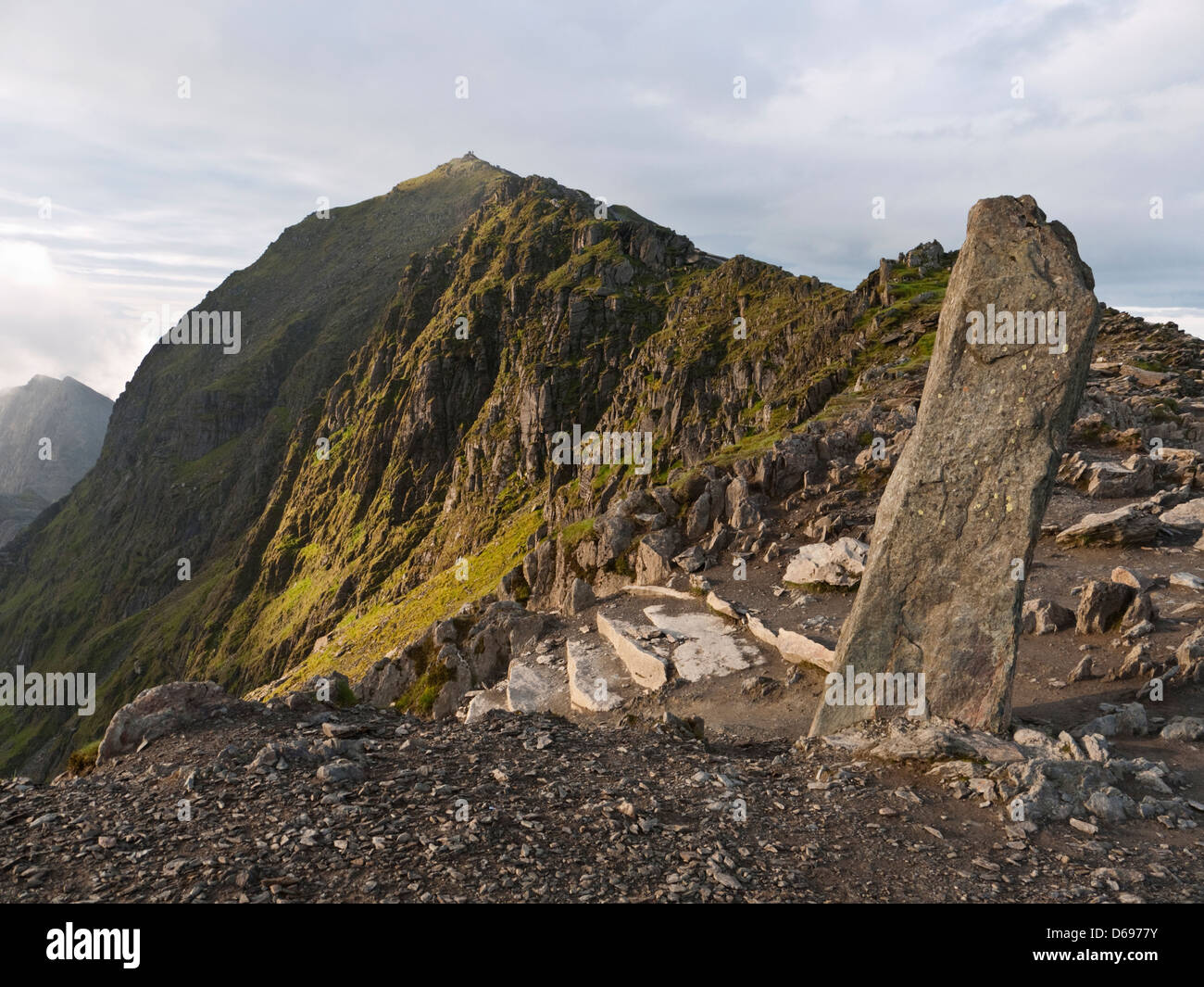 Yr Wyddfa, the summit of Snowdon, at sunrise, showing the stone pillar at the head of the Pyg Track Stock Photo