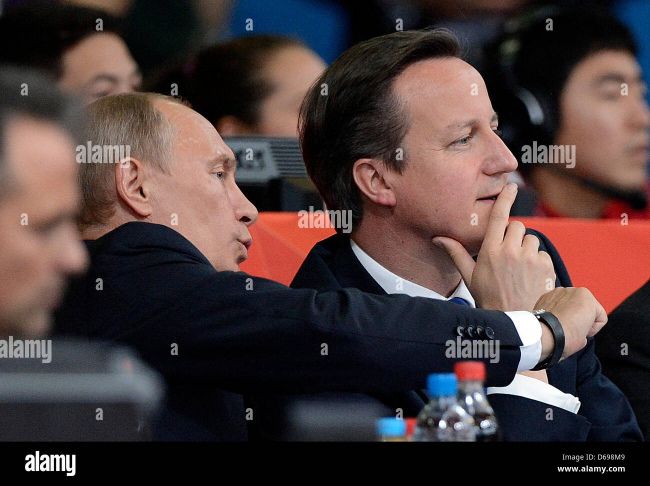 Russian President Vladimir Putin (L) and british President David Cameron attend the London 2012 Olympic Games Judo compettion in London, Great Britain, 02 August 2012. Photo: Marius Becker dpa  +++(c) dpa - Bildfunk+++ Stock Photo