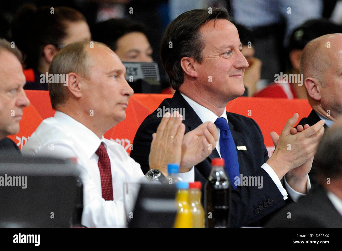Russian President Vladimir Putin (L) and british Prime Minister David Cameron attend the London 2012 Olympic Games Judo compettion in London, Great Britain, 02 August 2012. Photo: Marius Becker dpa  +++(c) dpa - Bildfunk+++ Stock Photo