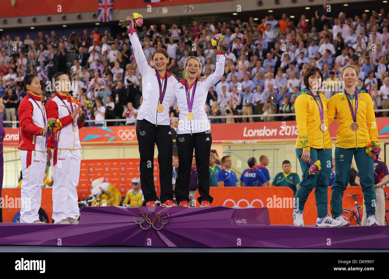 (L-R) Silver medalists Jinjie Gong and Shuang Guo of China, gold medalists Miriam Welte and Kristina Vogel of Germany and bronze medalists Anna Meares and Kaarle Mcculloch of Australia pose with their medals during the medal ceremony for the Women's team Sprint Track Cycling of the London 2012 Olympic Games at Velodrome, London, Great Britain, 02 August 2012. Photo: Christian Chari Stock Photo