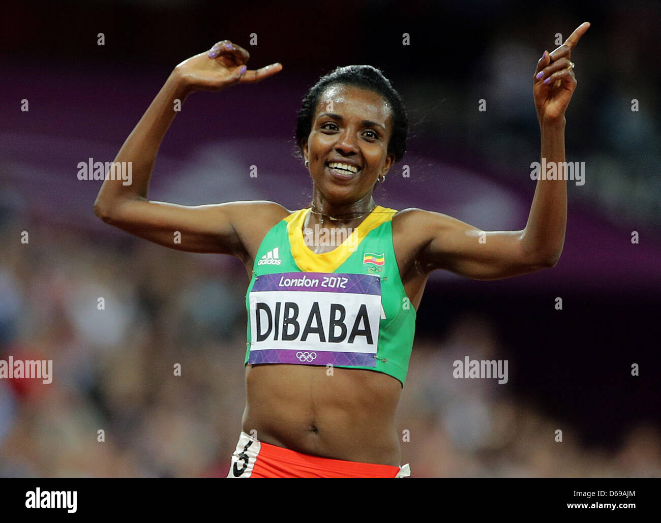 Tirunesh Dibaba of Ethiopia celebrates after winning the women's 10000m final during the London 2012 Olympic Games Athletics, Track and Field events at the Olympic Stadium, London, Britain, 03 August 2012. Photo: Michael Kappeler dpa  +++(c) dpa - Bildfunk+++ Stock Photo