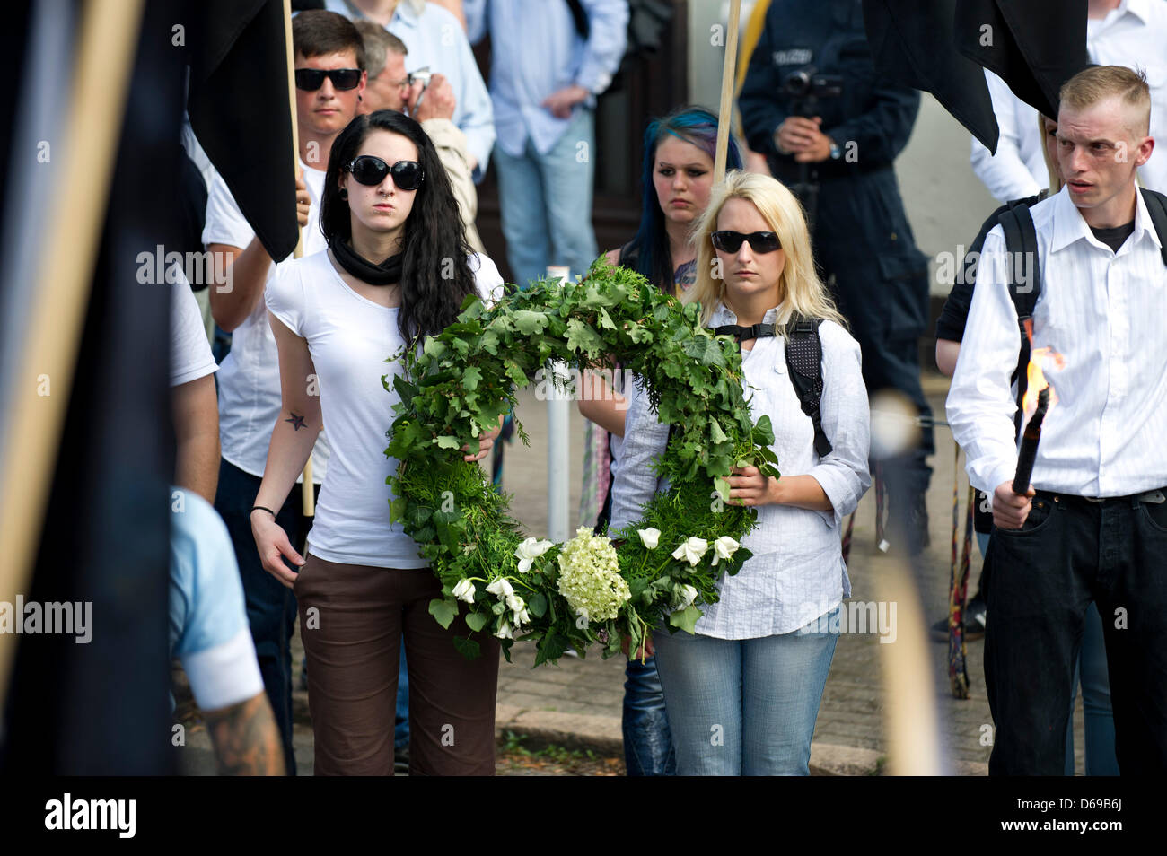 Two female neo-Nazis carry a wreath during a so-called 'March of ...