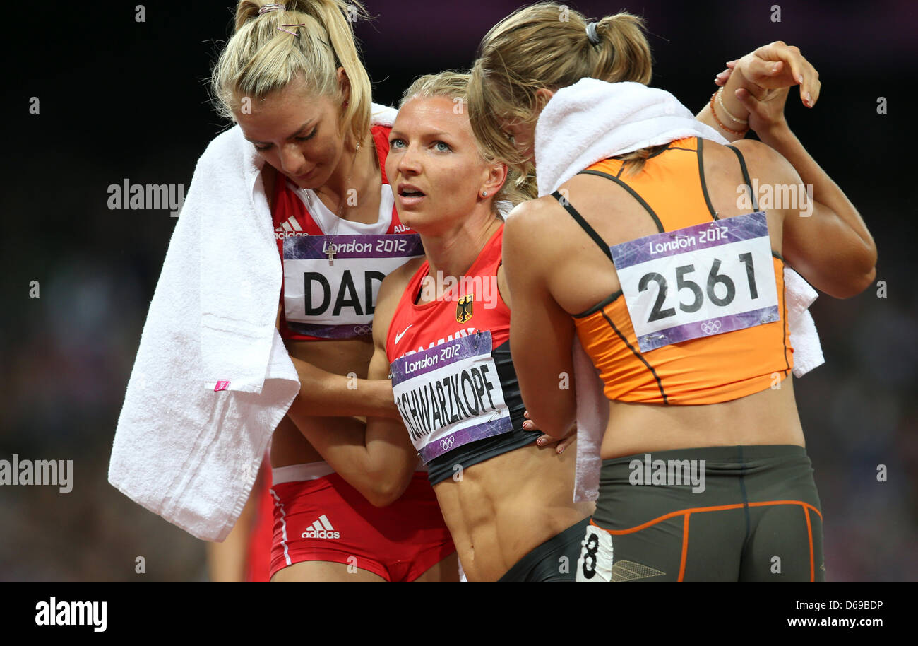 Germany's Lilli Schwarzkopf (M) reacts after the 800m of the Heptathlon ...