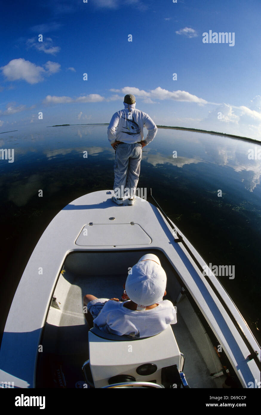 A fly fishing guide looking for rolling tarpon at Key West in the Florida Keys Stock Photo