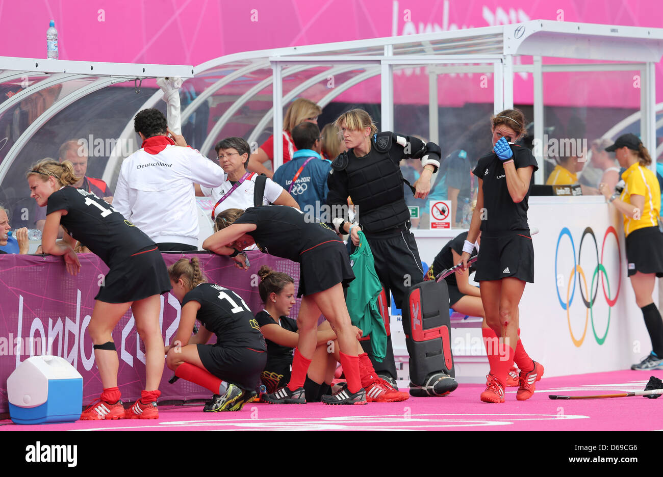 Germany's Katharina Otte (L-R) Lisa Hahn, Natascha Keller, goakeeper Yvonne Frank and Christina Schuetze look dejected after the match Germany vs New Zealand during the London 2012 Olympic Games Hockey tournament in the Riverside Arena in London, Great Britain, 06 August 2012. Photo: Christian Charisius dpa  +++(c) dpa - Bildfunk+++ Stock Photo