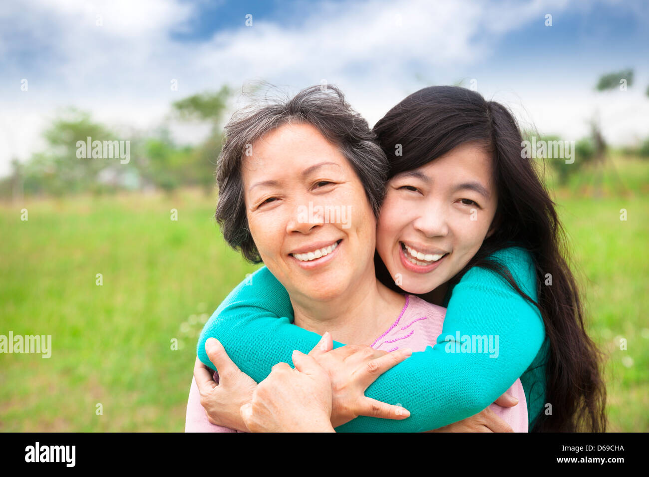 young woman hugging with her mother Stock Photo