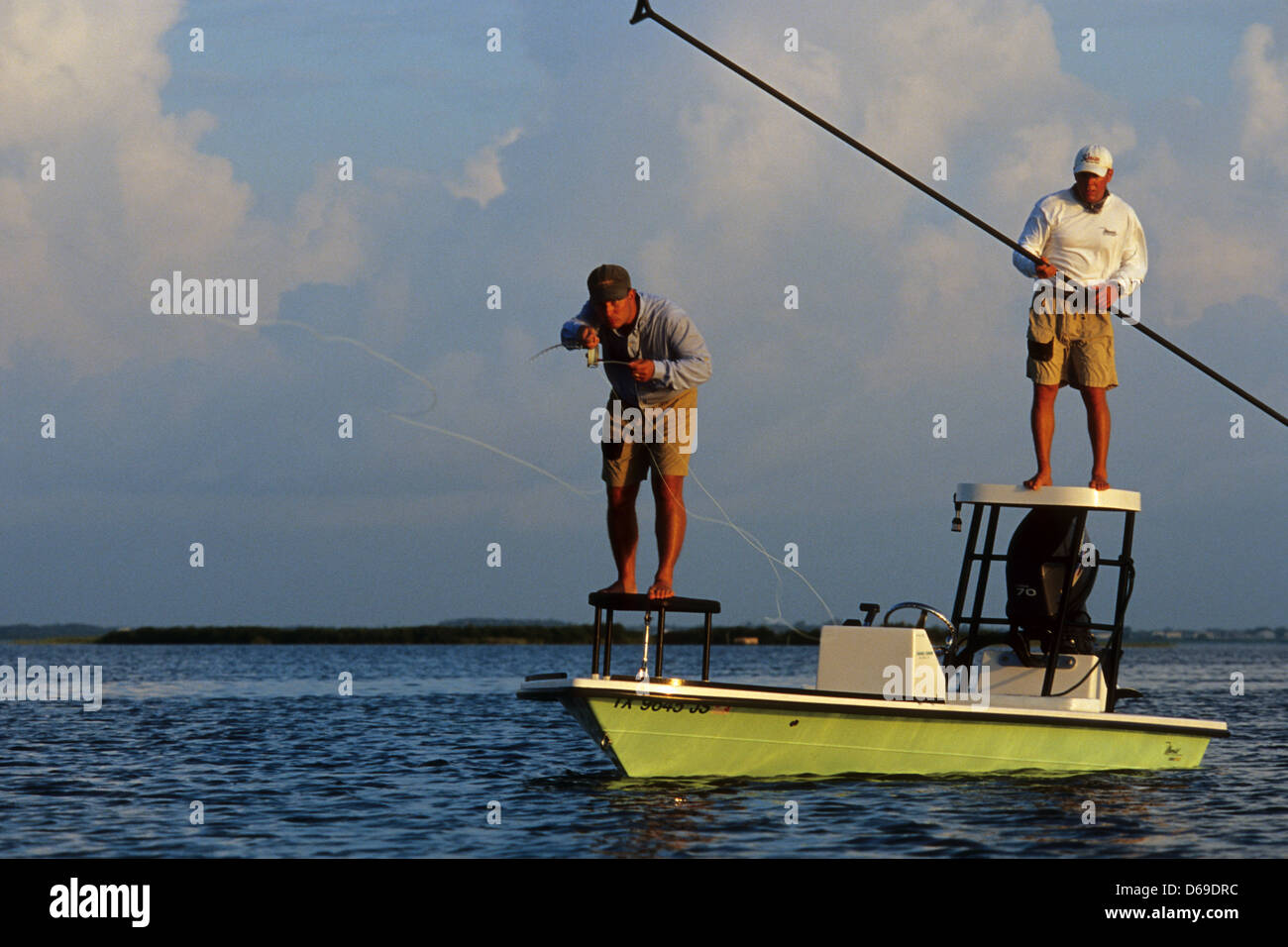 A fly fisherman and his guide casting for redfish from their poling skiff  near Port Aransas Texas Stock Photo - Alamy