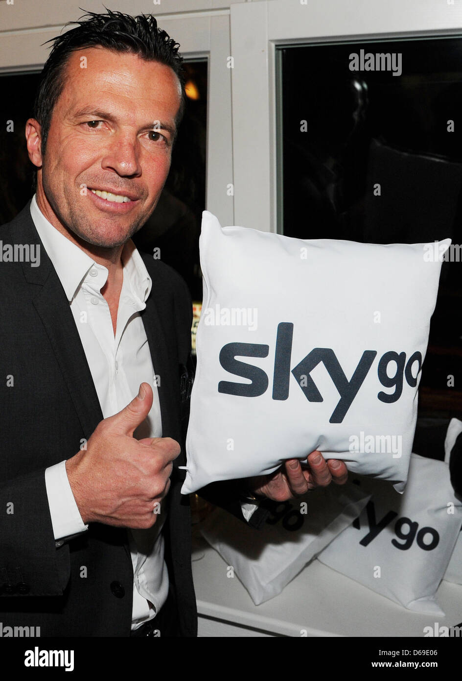 (FILE) An archive photo dated 07 April 2011 shows soccer coach Lothar Matthaeus receiving a cushion with 'Sky Go' written on it from Sky broadcasters at Soho House in Berlin, Germany. Matthaeus will be a television expert. The 1990 world champion soccer player will appear regularly for the top matches of the week on Saturday evening for Sky, according to the pay TV channel on Tuesd Stock Photo