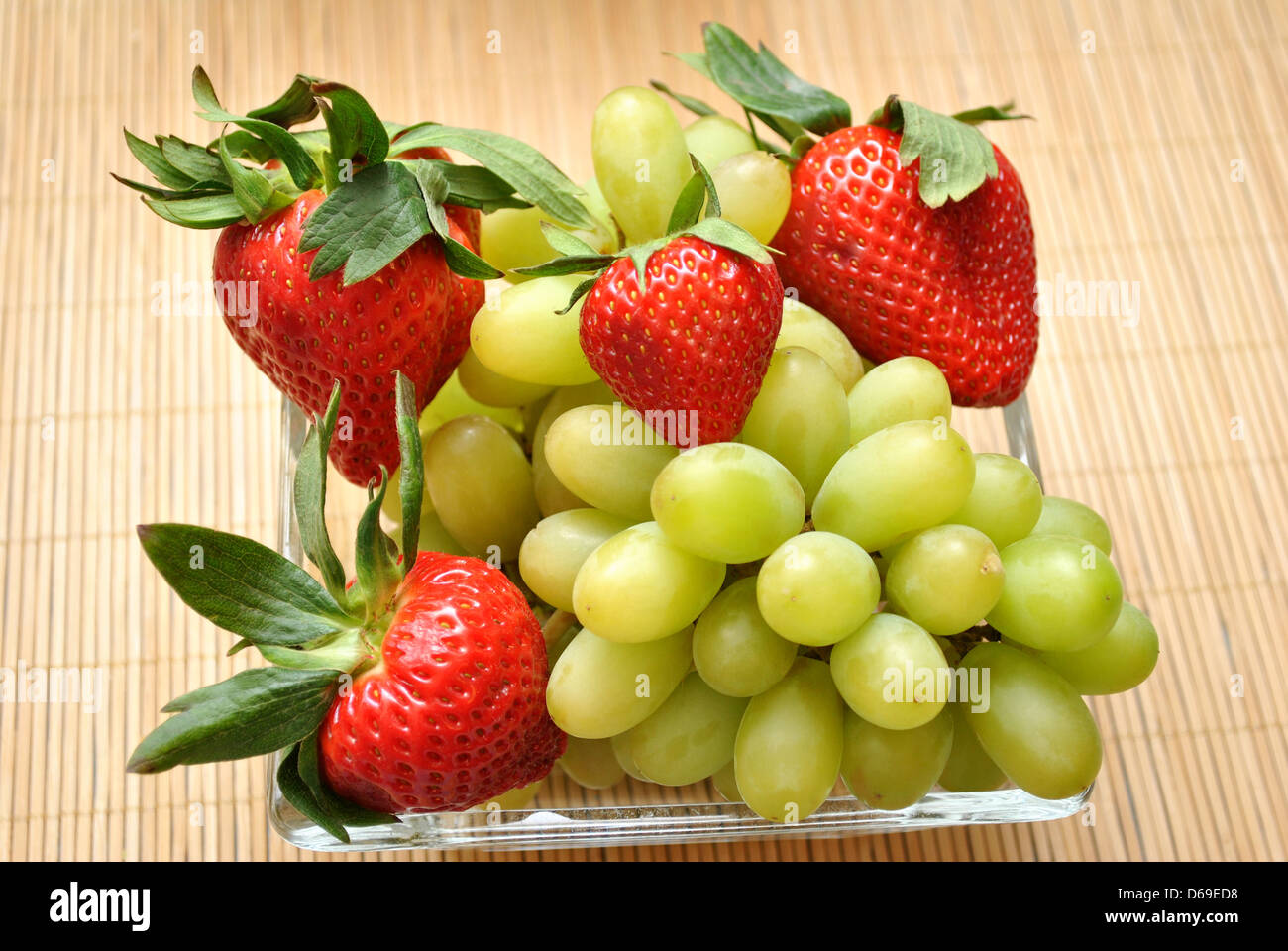 Healthy Snack of Grapes and Strawberries Stock Photo