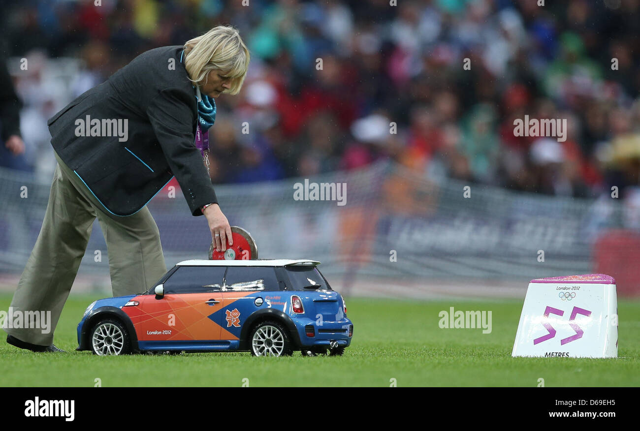 A specially designed radio controlled electric Mini car transports discuses across the field