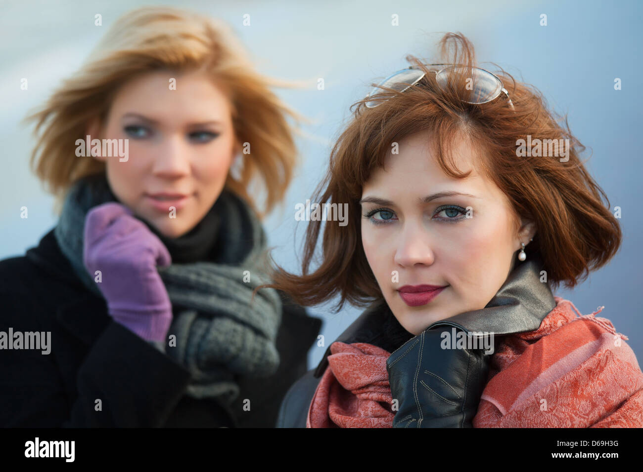 Two young women on a city street Stock Photo - Alamy