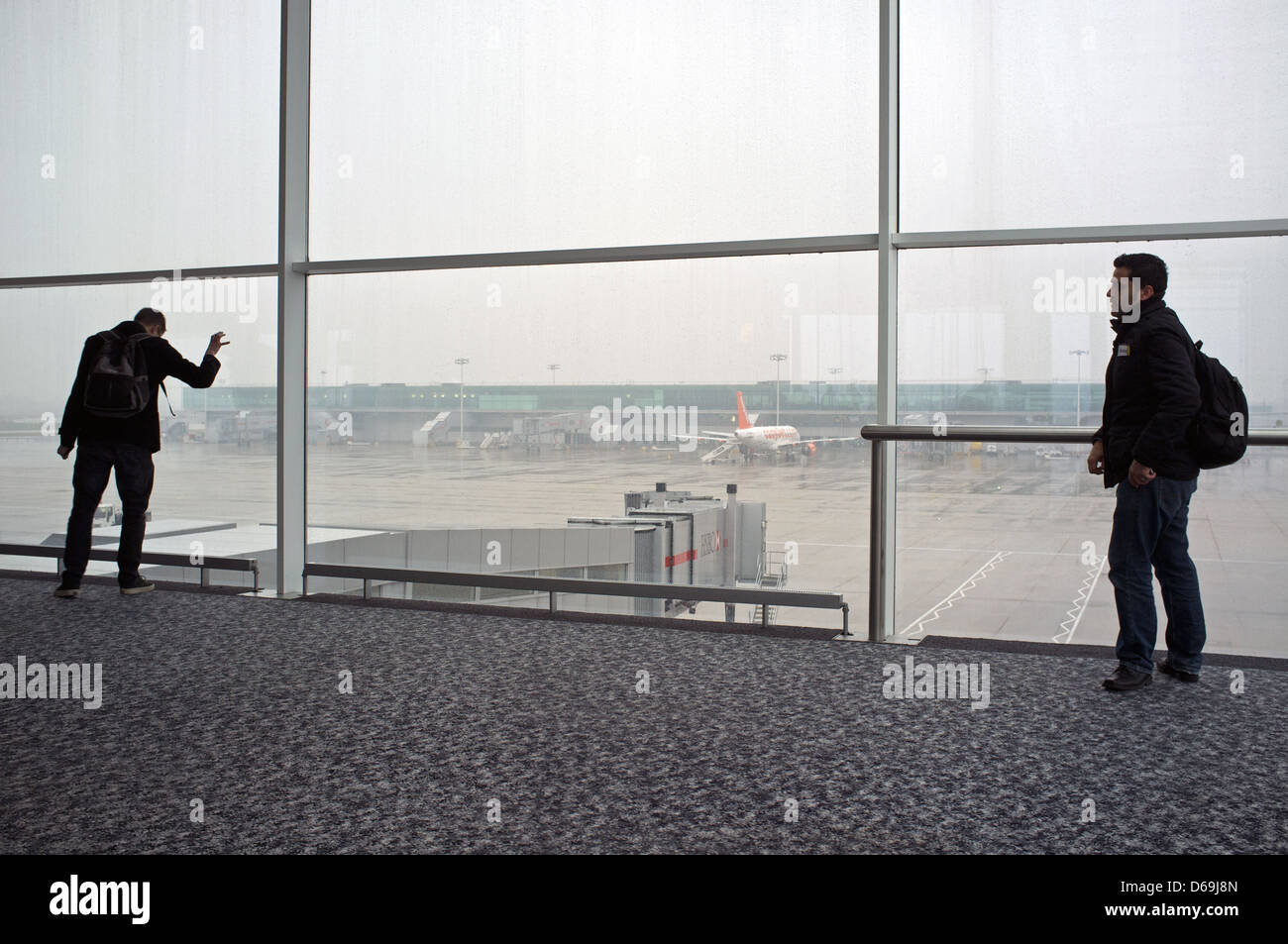 Passengers waiting for their flight, Stansted airport Essex UK Stock Photo