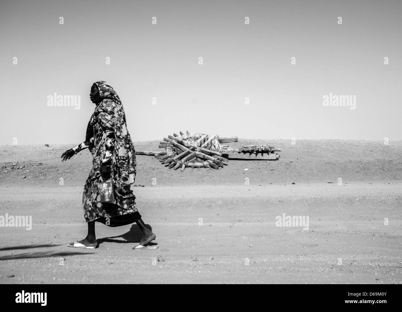 Nubian Woman Passing In Front Of An Old Well, Sesebi, Sudan Stock Photo