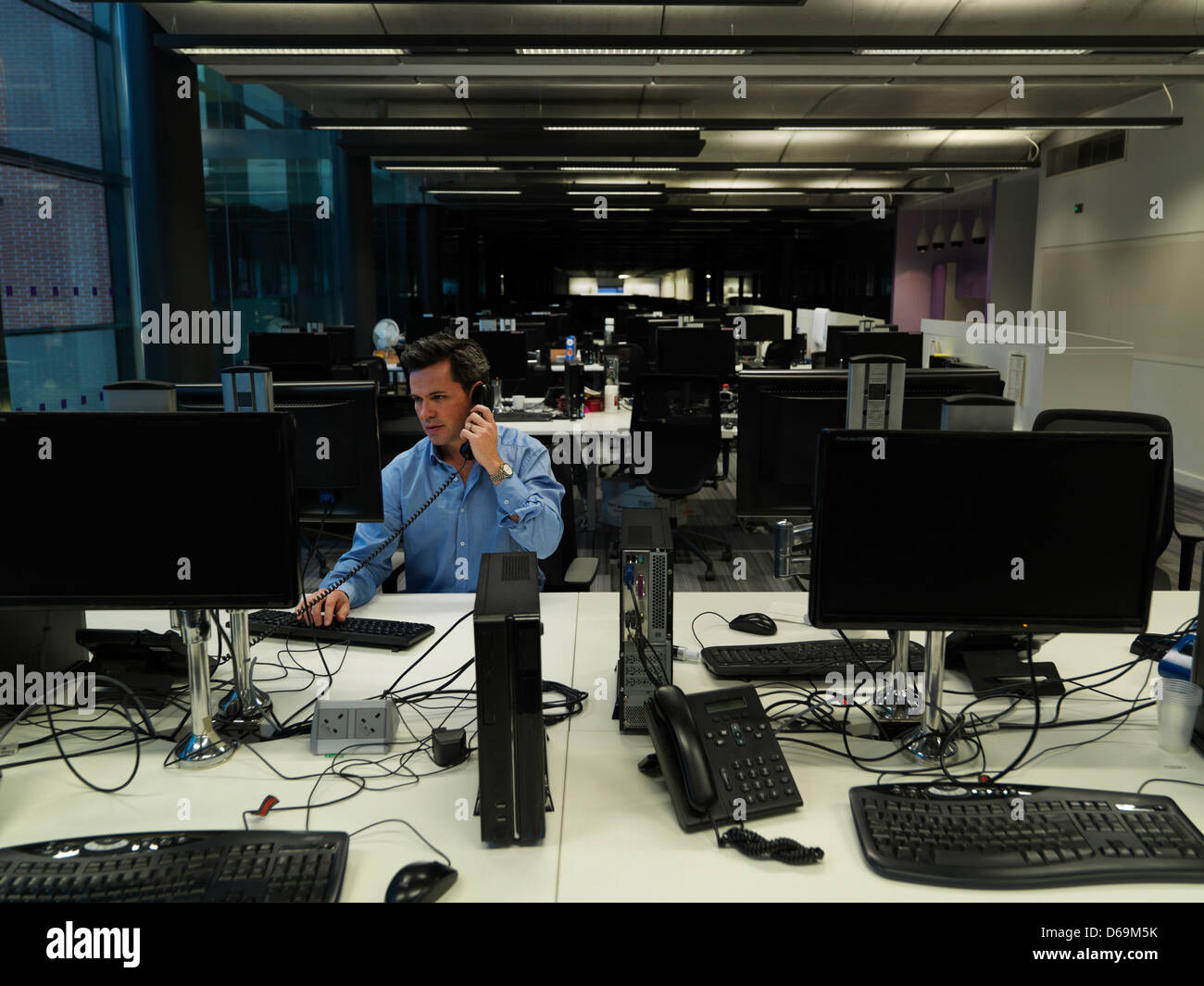 Businessman working late in office Stock Photo