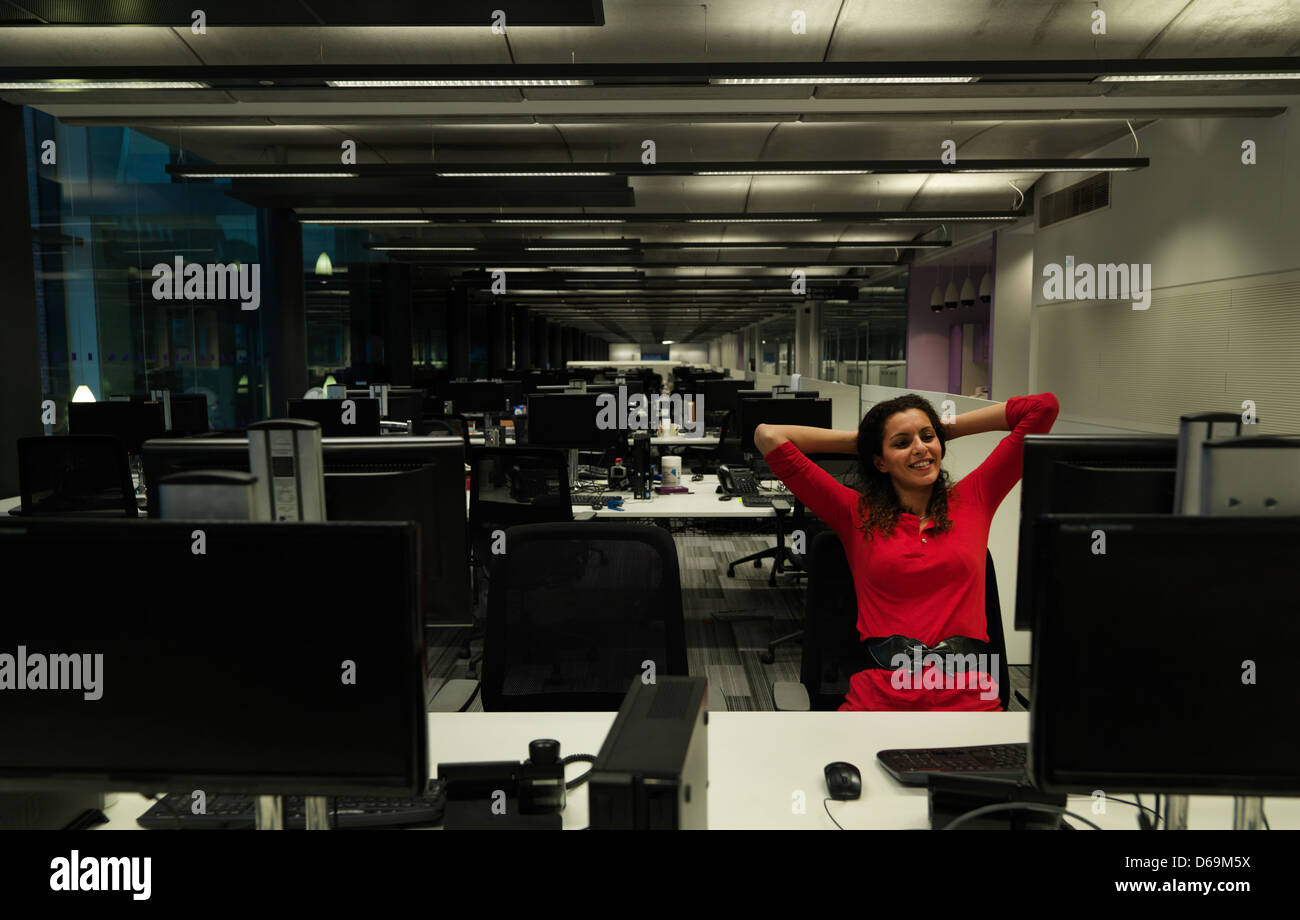 Businesswoman working late in office Stock Photo