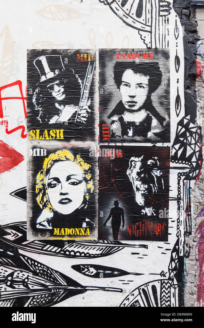 Posters of Madonna,Slash and Anarchy on graffiti covered wall in the Inner Courtyard of the Haus Schwarzenberg, Mitte Stock Photo