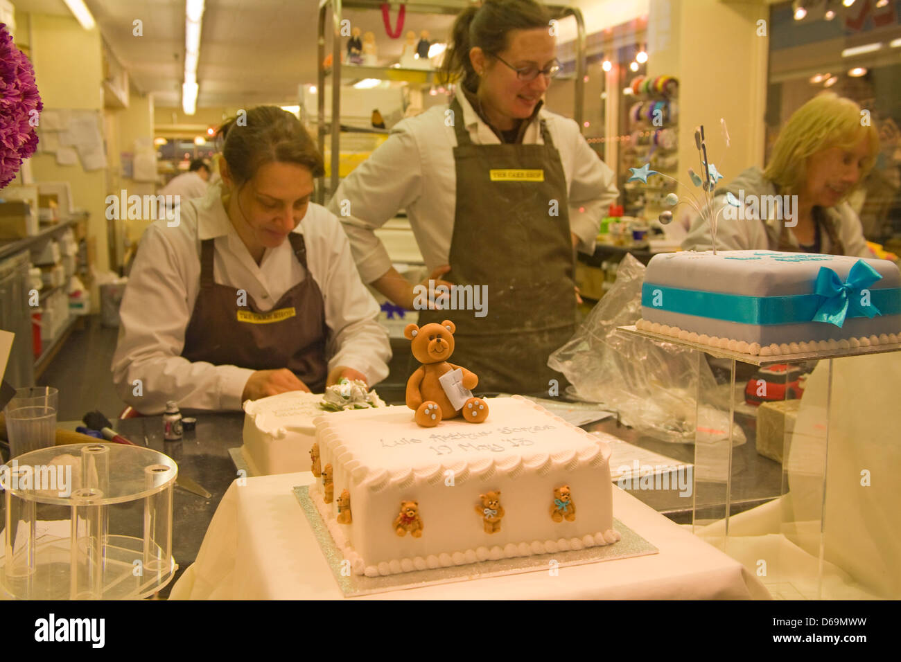 UK Women in the Cake Shop making decorated special occasion cakes Stock Photo