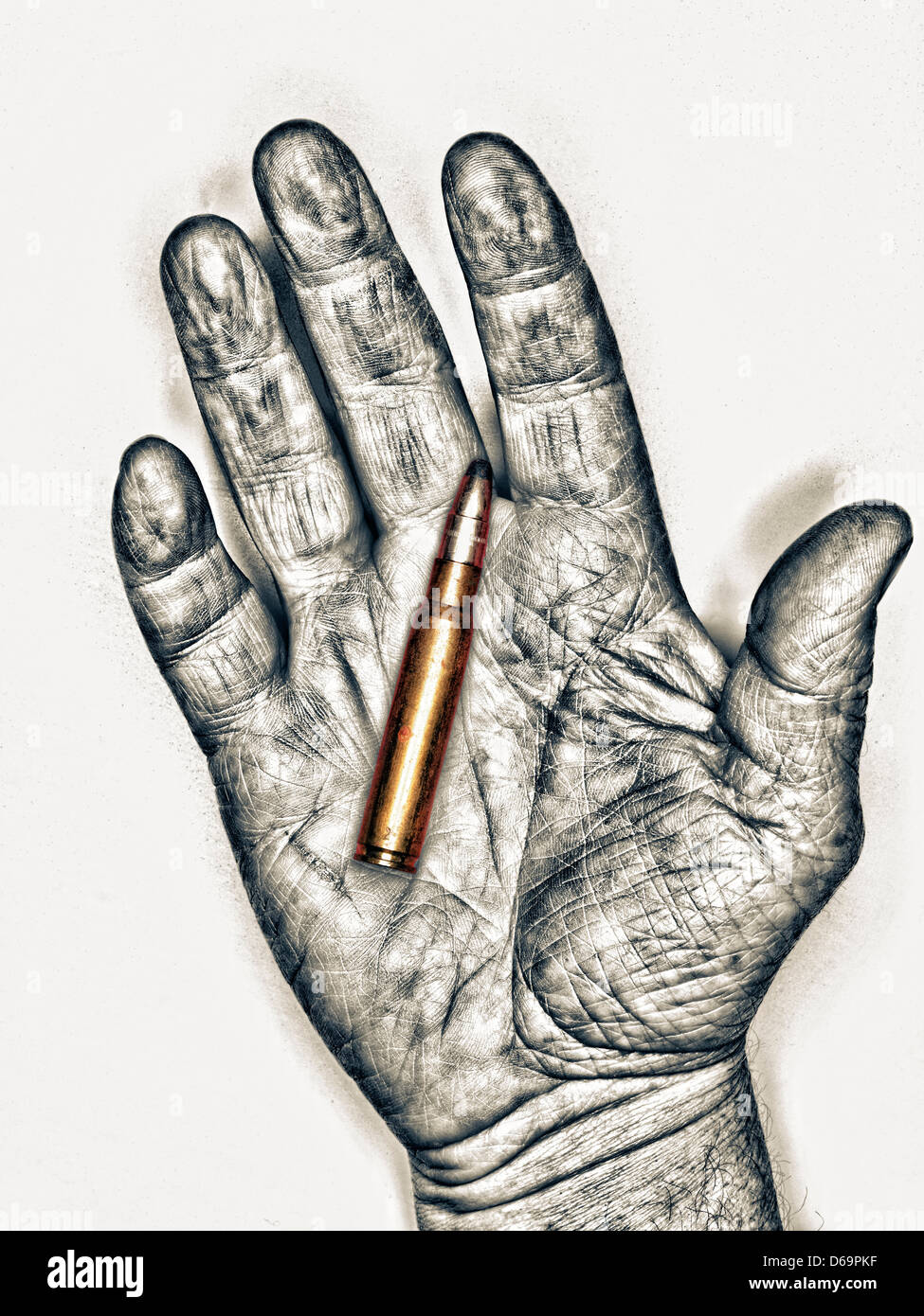 Black and white hand holding bullet Stock Photo