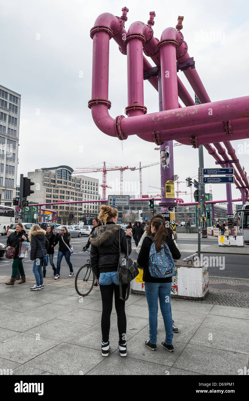 Giant Pink pipes that drain surface water that floods construction sites and convey it to canal