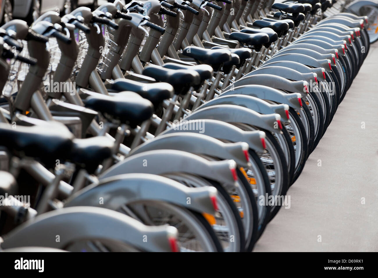 Bicycled parked in row on city street Stock Photo