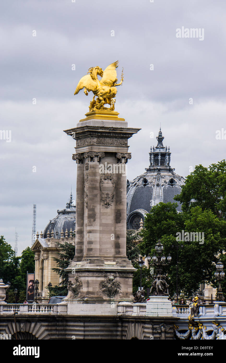 Alexandre III bridge statues and Petite Palais in background in Paris France Stock Photo