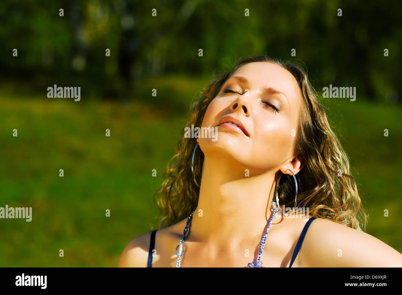 Young woman relaxing on nature Stock Photo - Alamy