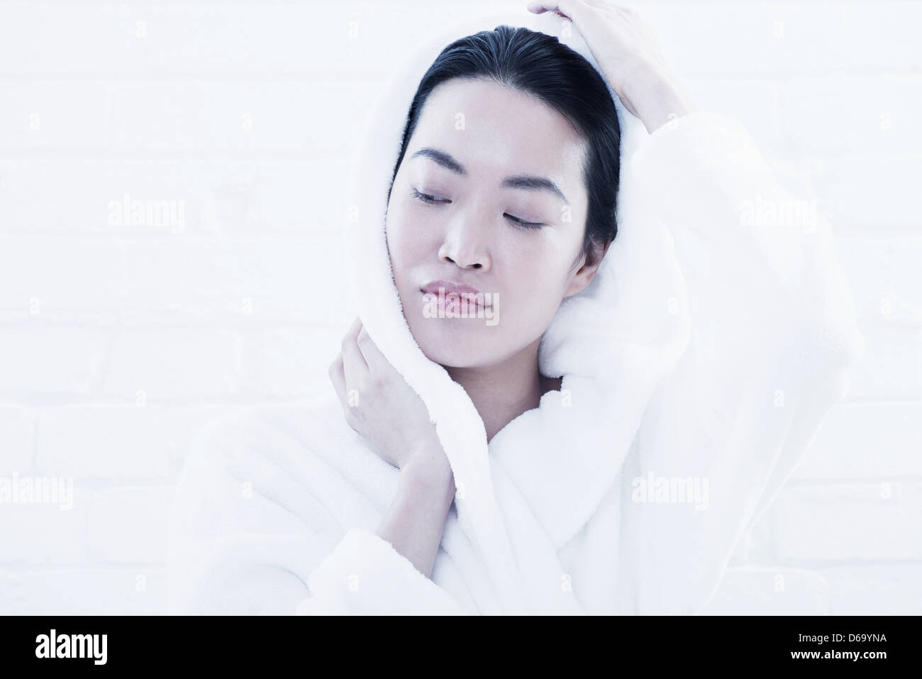 Woman drying her face with towel Stock Photo Alamy