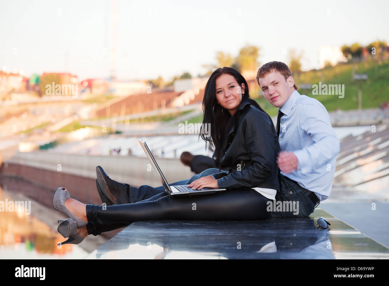 Young couple with laptop Stock Photo - Alamy