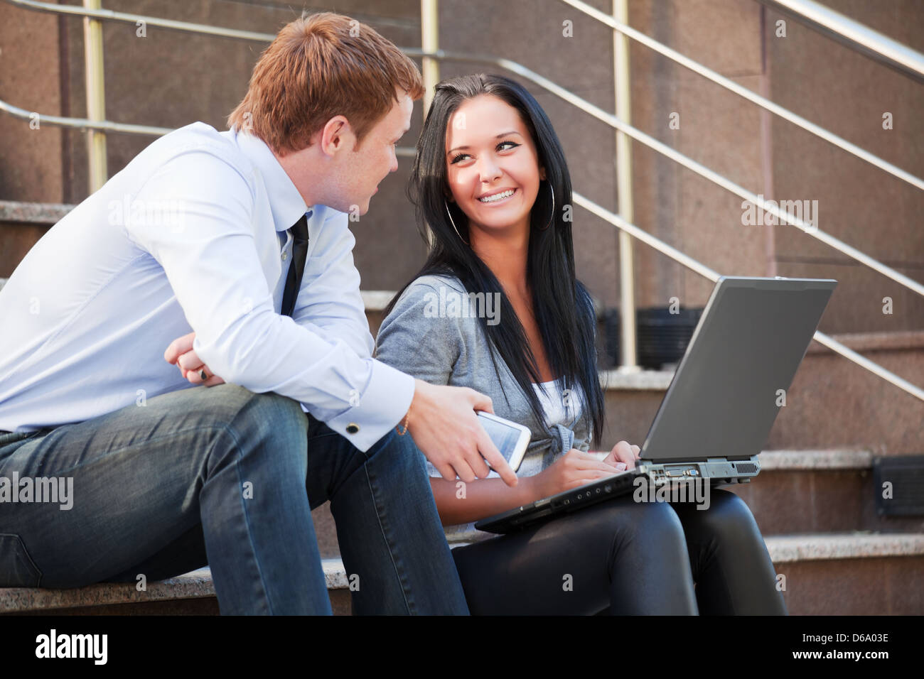 Young couple with laptop Stock Photo - Alamy