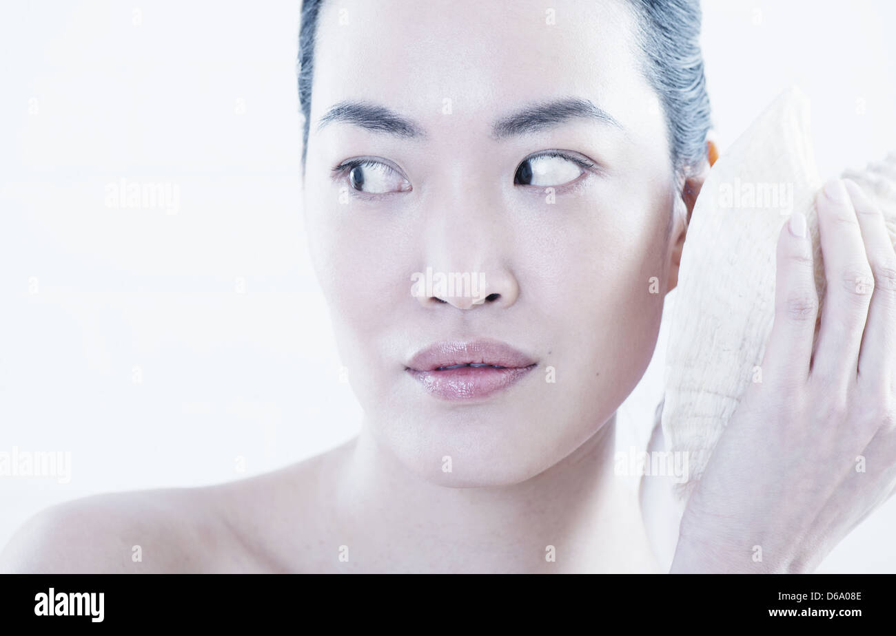 Woman applying ice pack to face Stock Photo Alamy