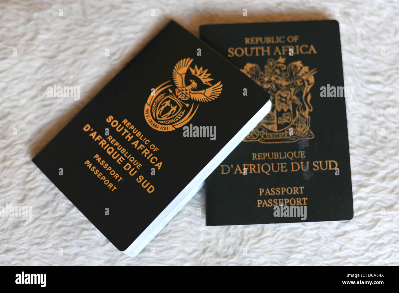 An example of an old South African passport next to a new South African passport Stock Photo Alamy