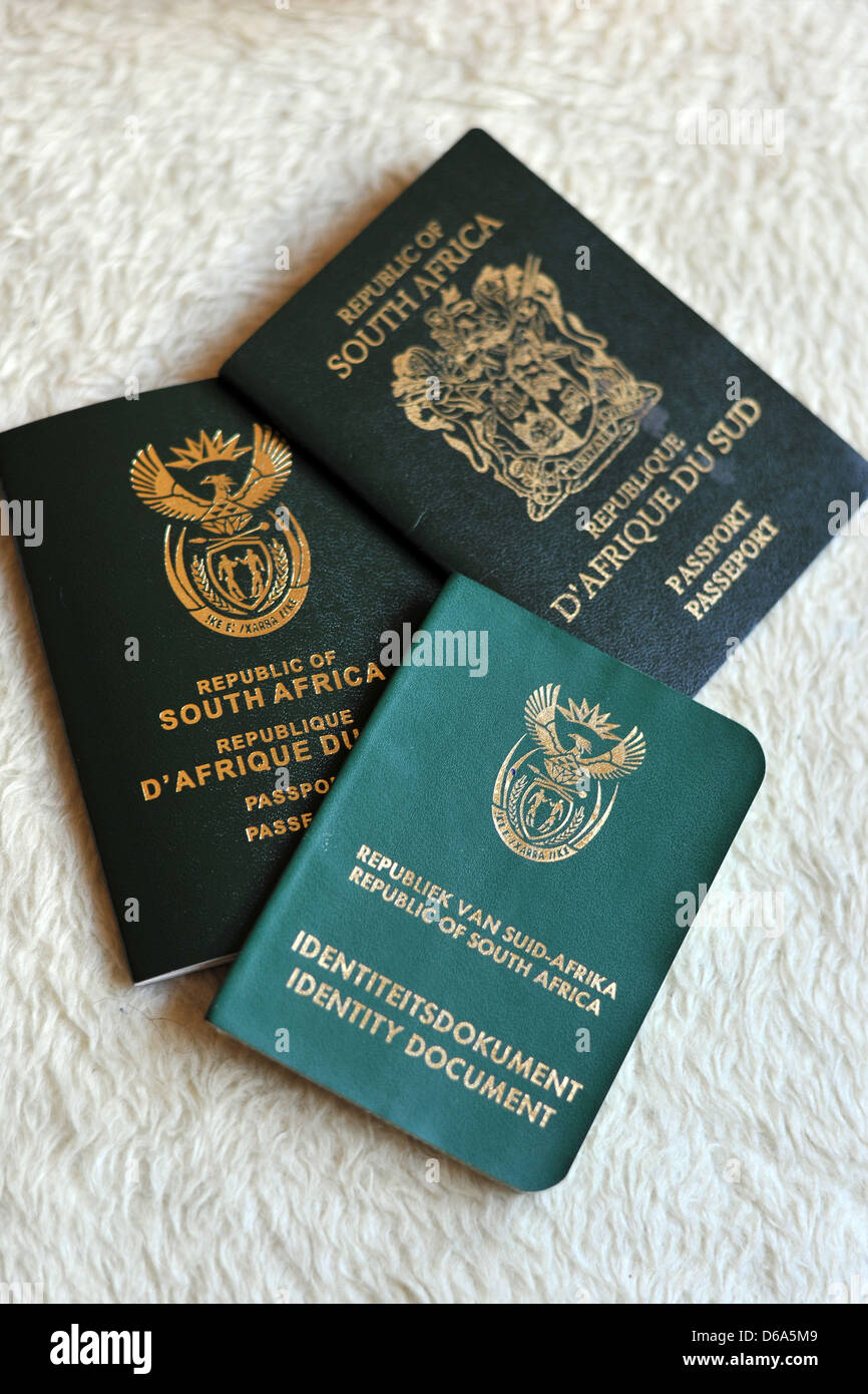 A new South African passport next to a South African Identity Document