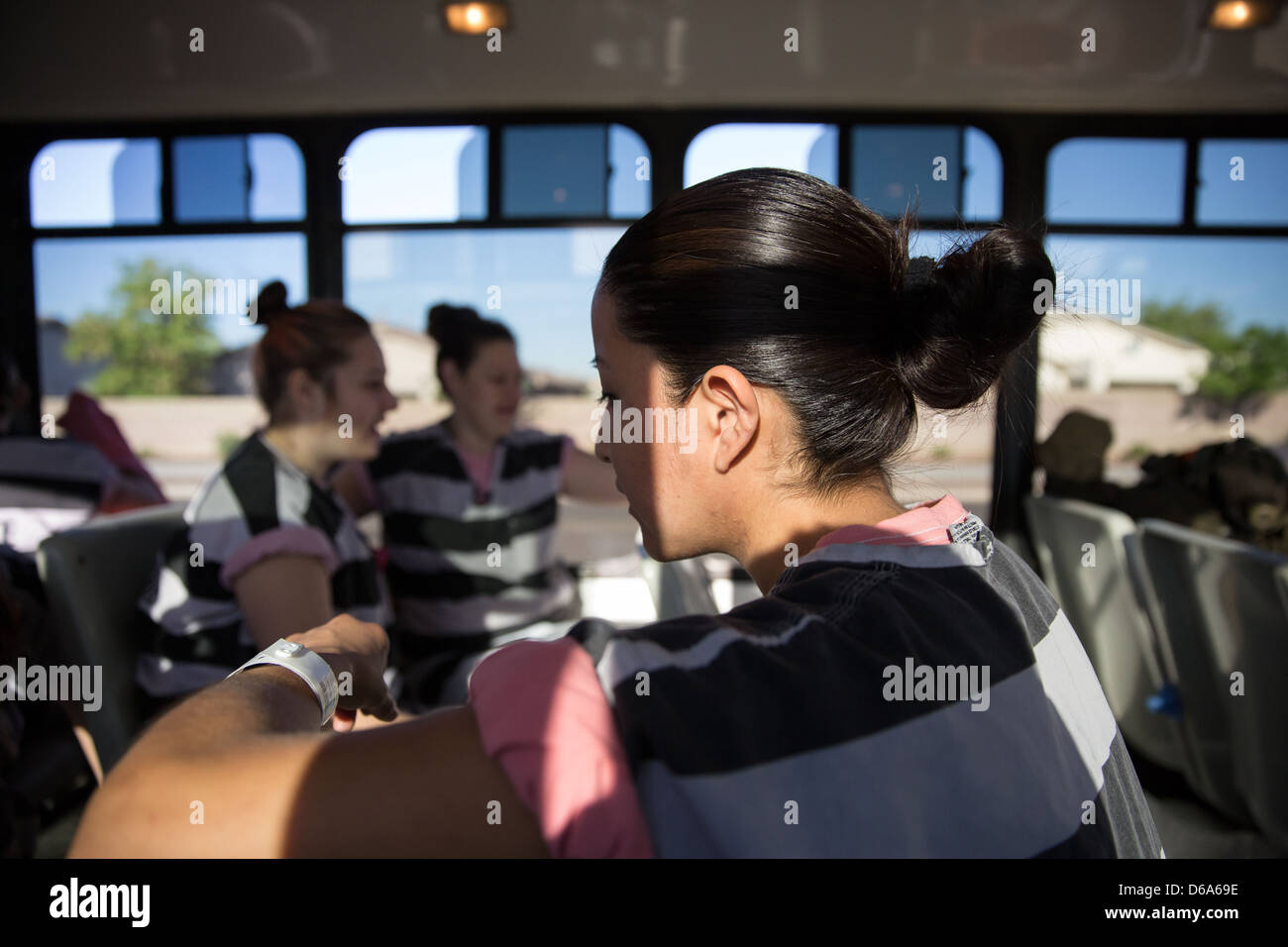 Female inmates on the bus. Stock Photo