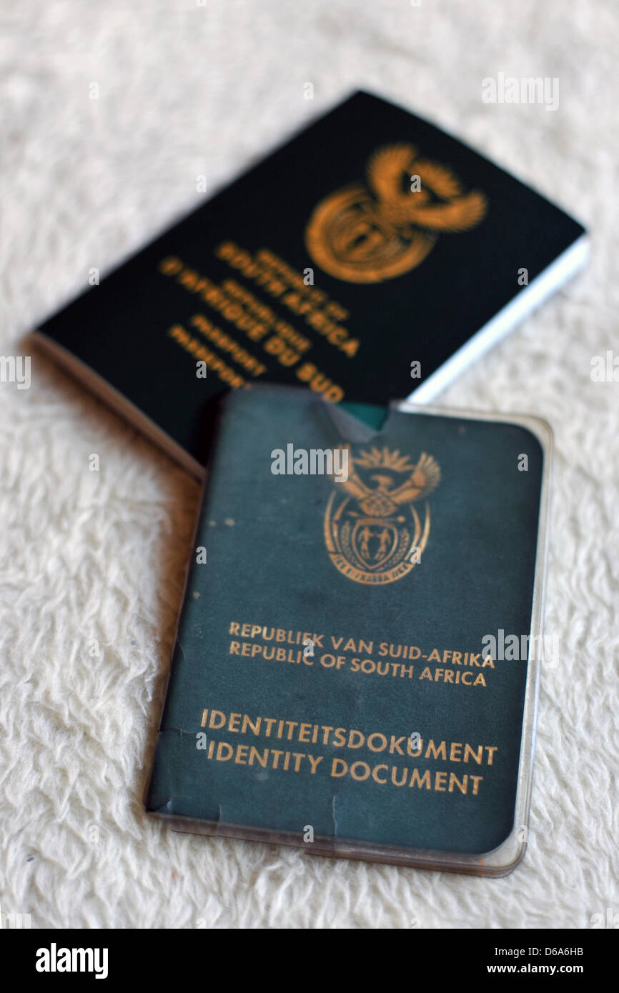 A new South African passport next to a South African Identity Document