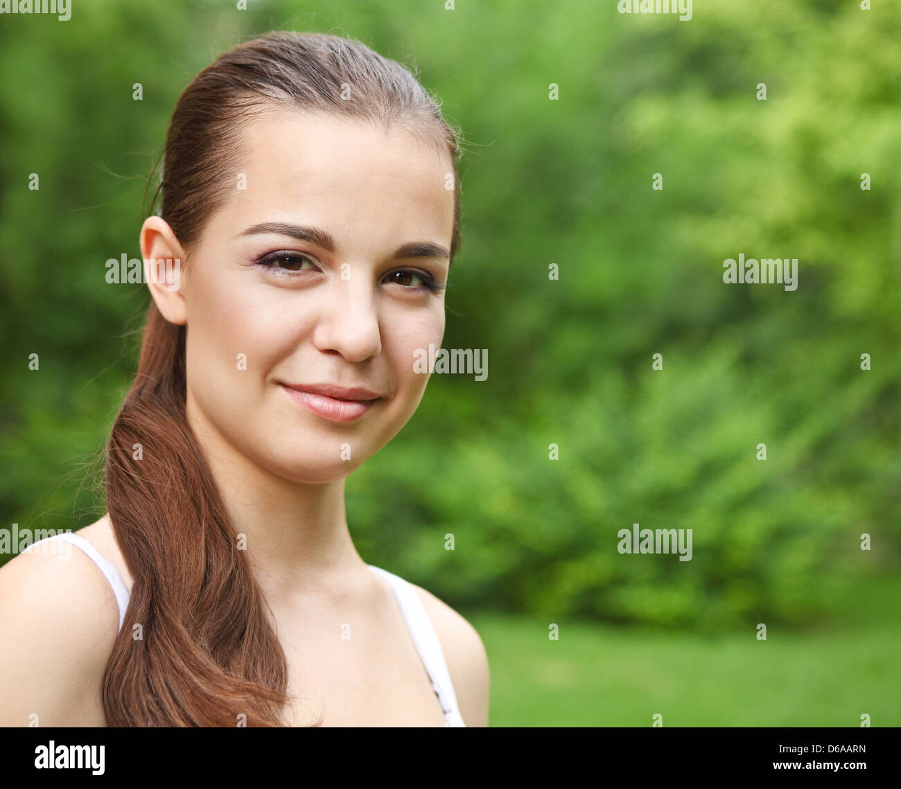 Beautiful young girl in summer park Stock Photo - Alamy