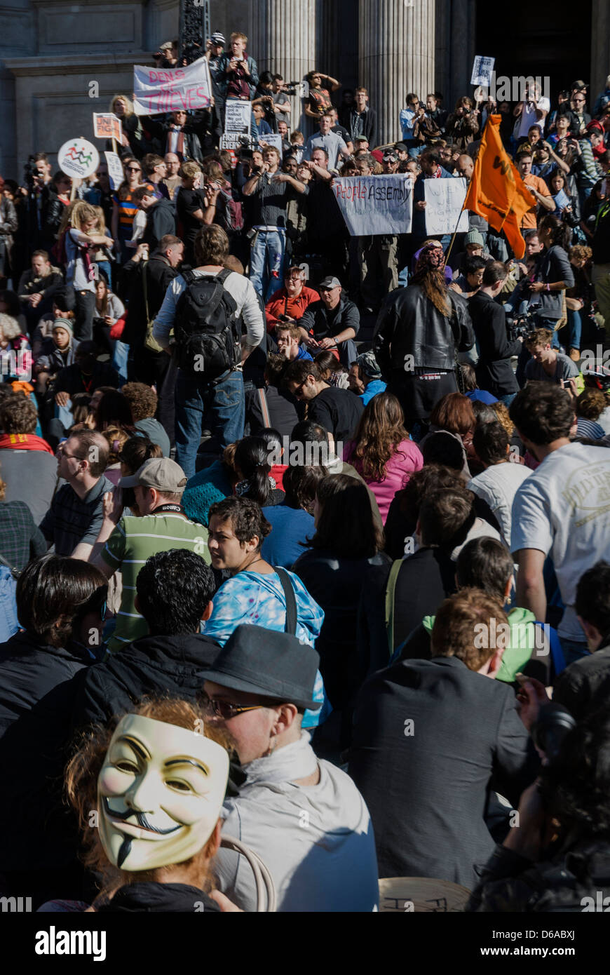 Protesters are wearing V For Vendetta mask at Occupy London Stock Exchange. Stock Photo