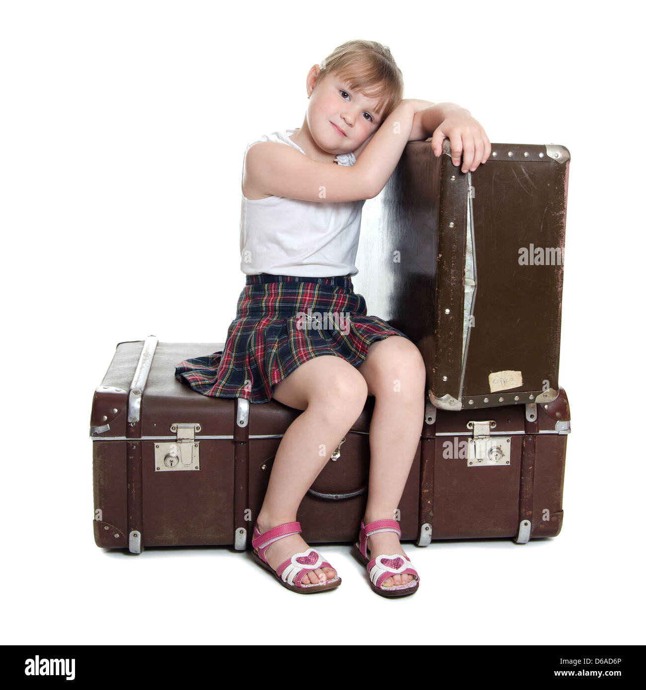 The little girl on old suitcases Stock Photo Alamy