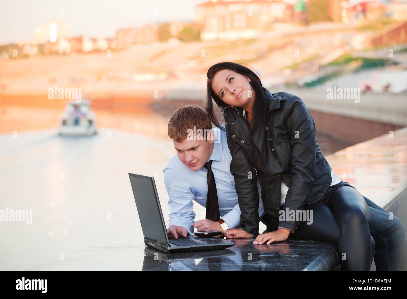 Young couple with laptop Stock Photo - Alamy
