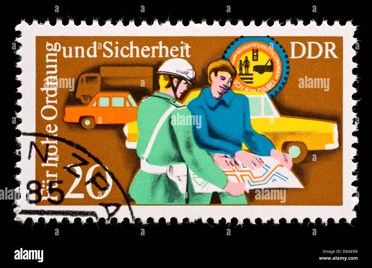 Postage stamp from East Germany (DDR) depicting a policeman helping a motorist. Stock Photo