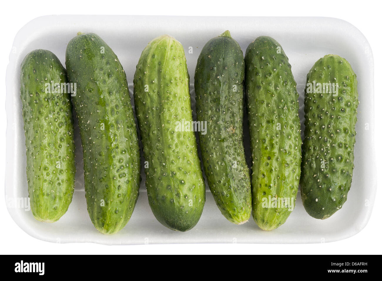 Limp old green cucumbers Stock Photo