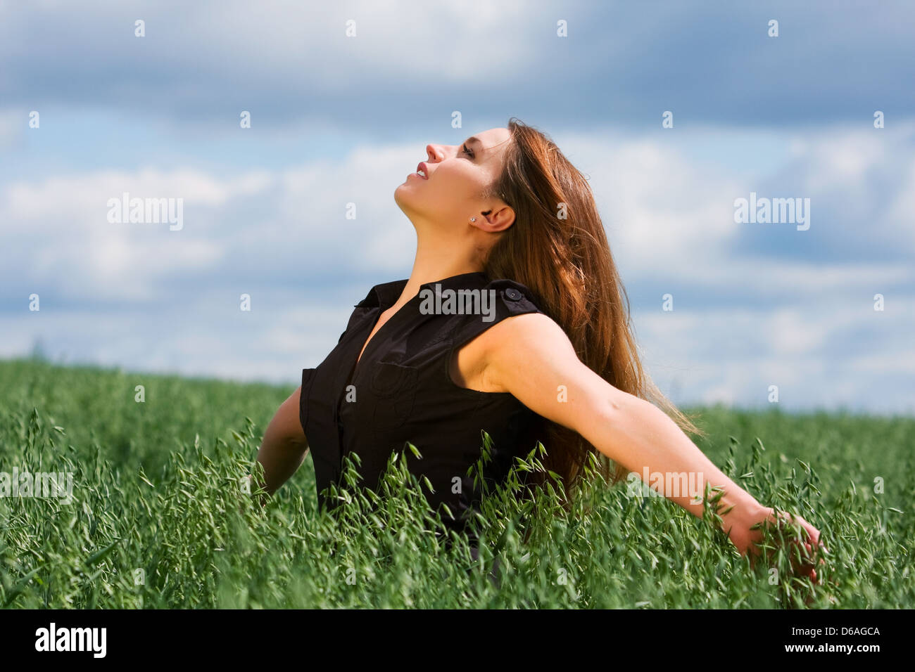 Happy young woman relaxing on nature Stock Photo - Alamy