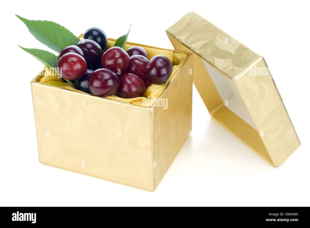 Cherries golden gift concept Stock Photo