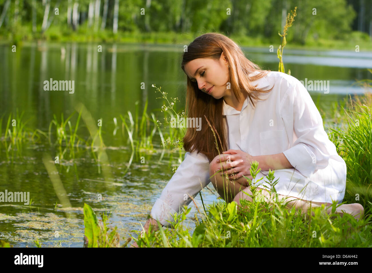 Young woman relaxing on nature Stock Photo - Alamy