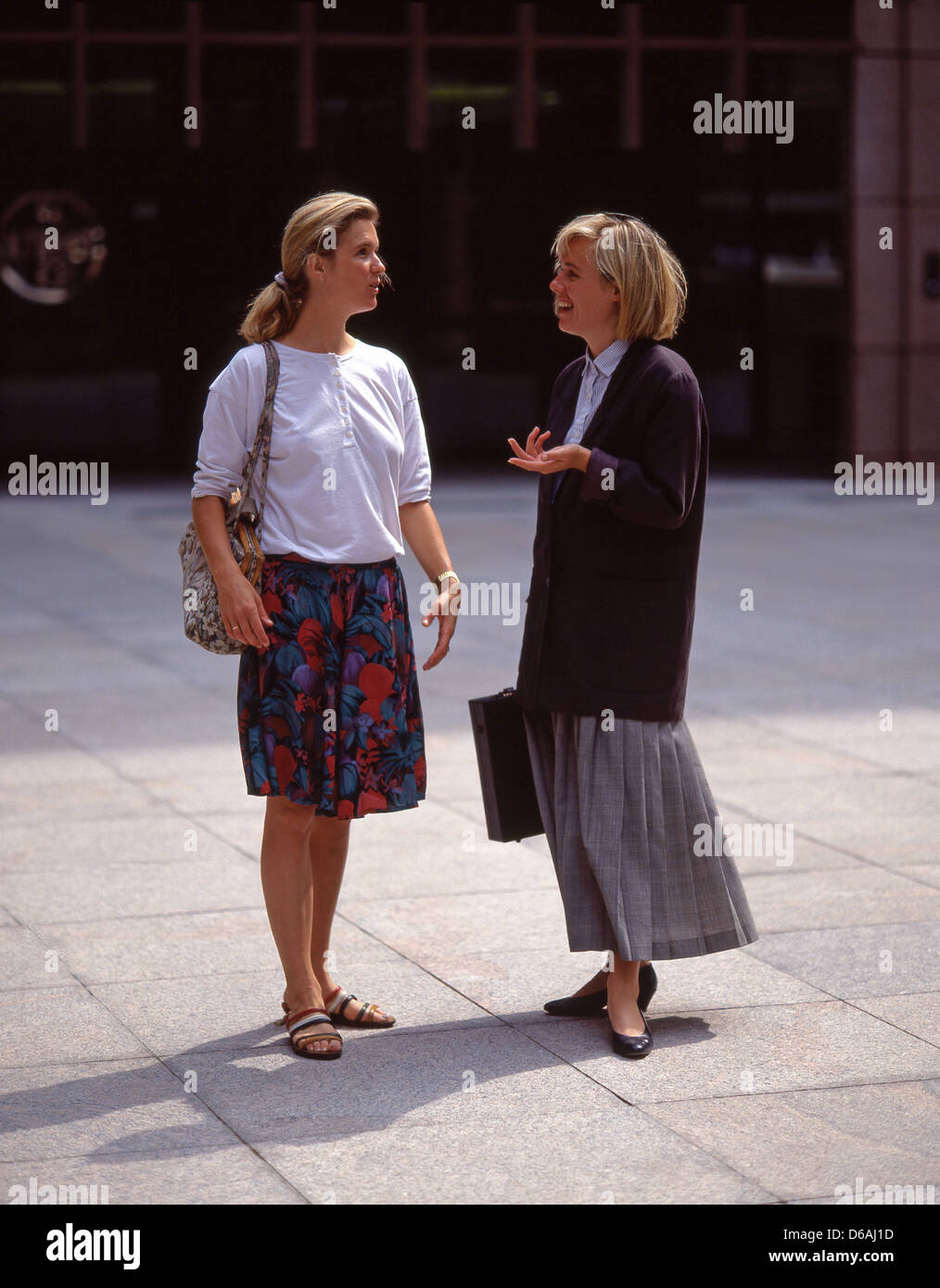 Business women chatting in financial district, Bishopsgate, City of London, London, England, United Kingdom Stock Photo