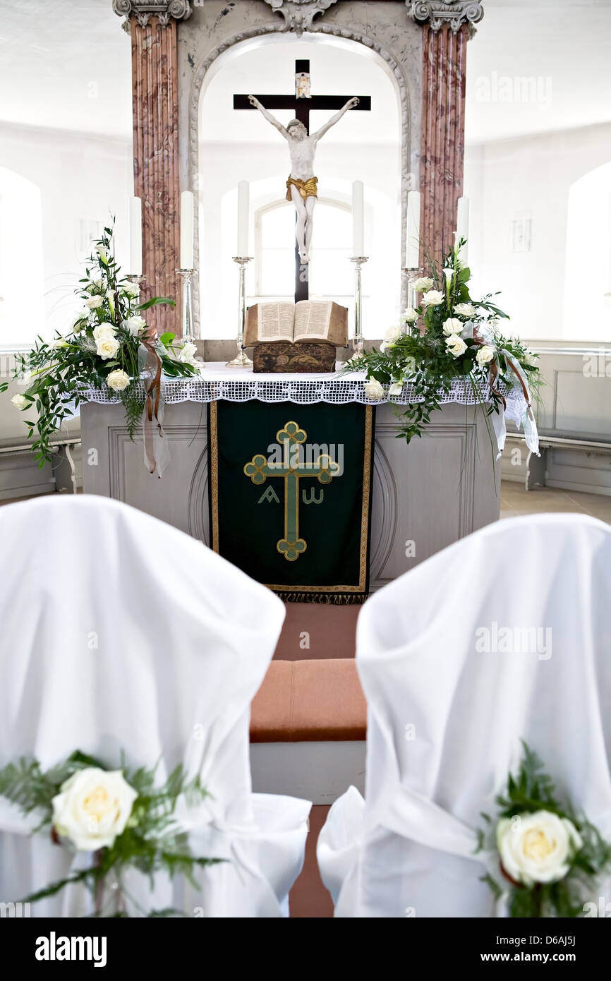 Holy Bible and Flowers on altar in the church Stock Photo Alamy