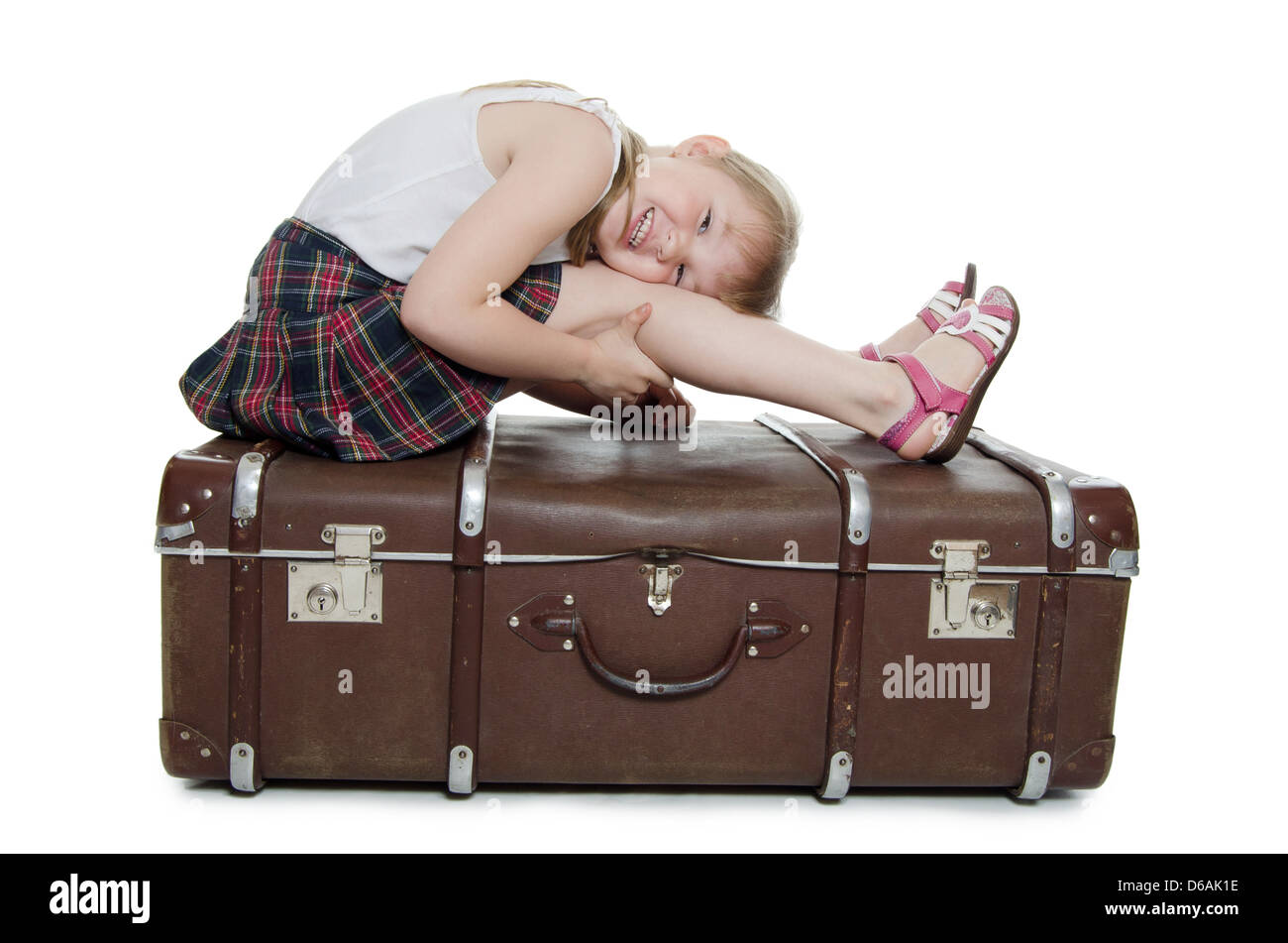 The little girl on old suitcases Stock Photo Alamy